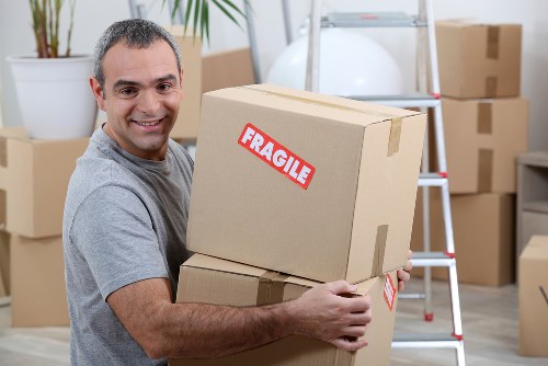 Packing supplies and labelled boxes prepared for a move in Brent