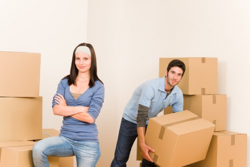 Commercial office relocation team preparing equipment for transport