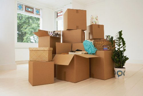 Local moving team handling boxes and furniture in Brent
