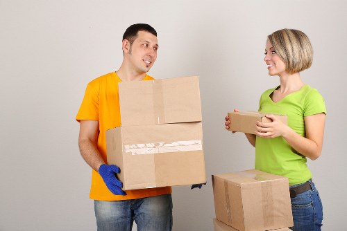 Careful wrapping of fragile items during a Brent home move