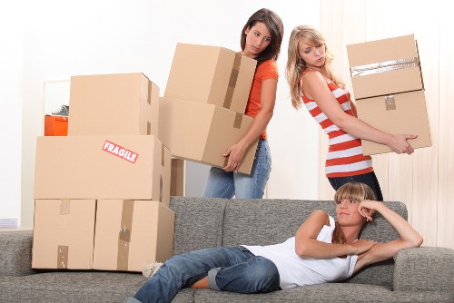 Packed boxes and furniture ready for local removals in Brent