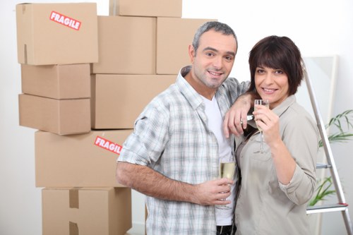 Packed household boxes and wrapped furniture ready for a Brent move